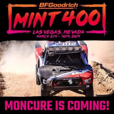 Event poster for the 2019 BFGoodrich Mint 400 in Las Vegas featuring a Toyota race truck kicking up dust on a dirt track, with the text MONCURE IS COMING! at the bottom.