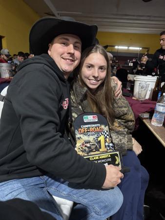 Jack Moncure and Samantha Otten holding a first-place trophy for the 2025 Record Off-Road Series race.